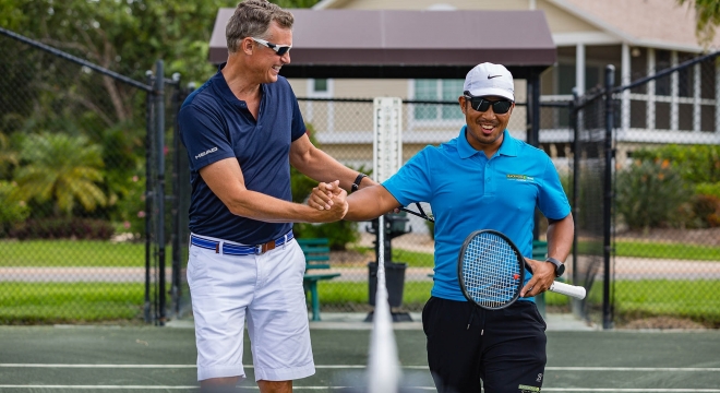 People playing tennis at the Dunes of Sanibel