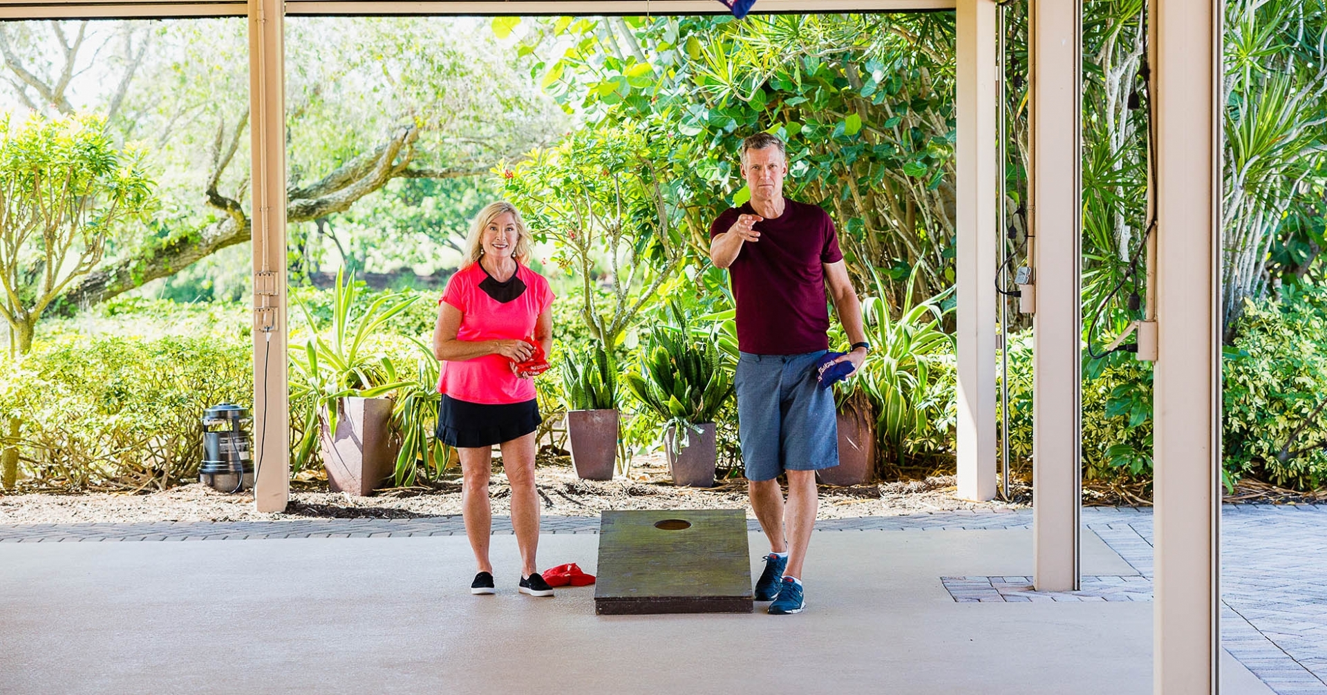 Couple plays cornhole at the best hotel on Sanibel Island