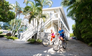 Couple biking around the top rated Sanibel Island Resort, Sanibel Inn