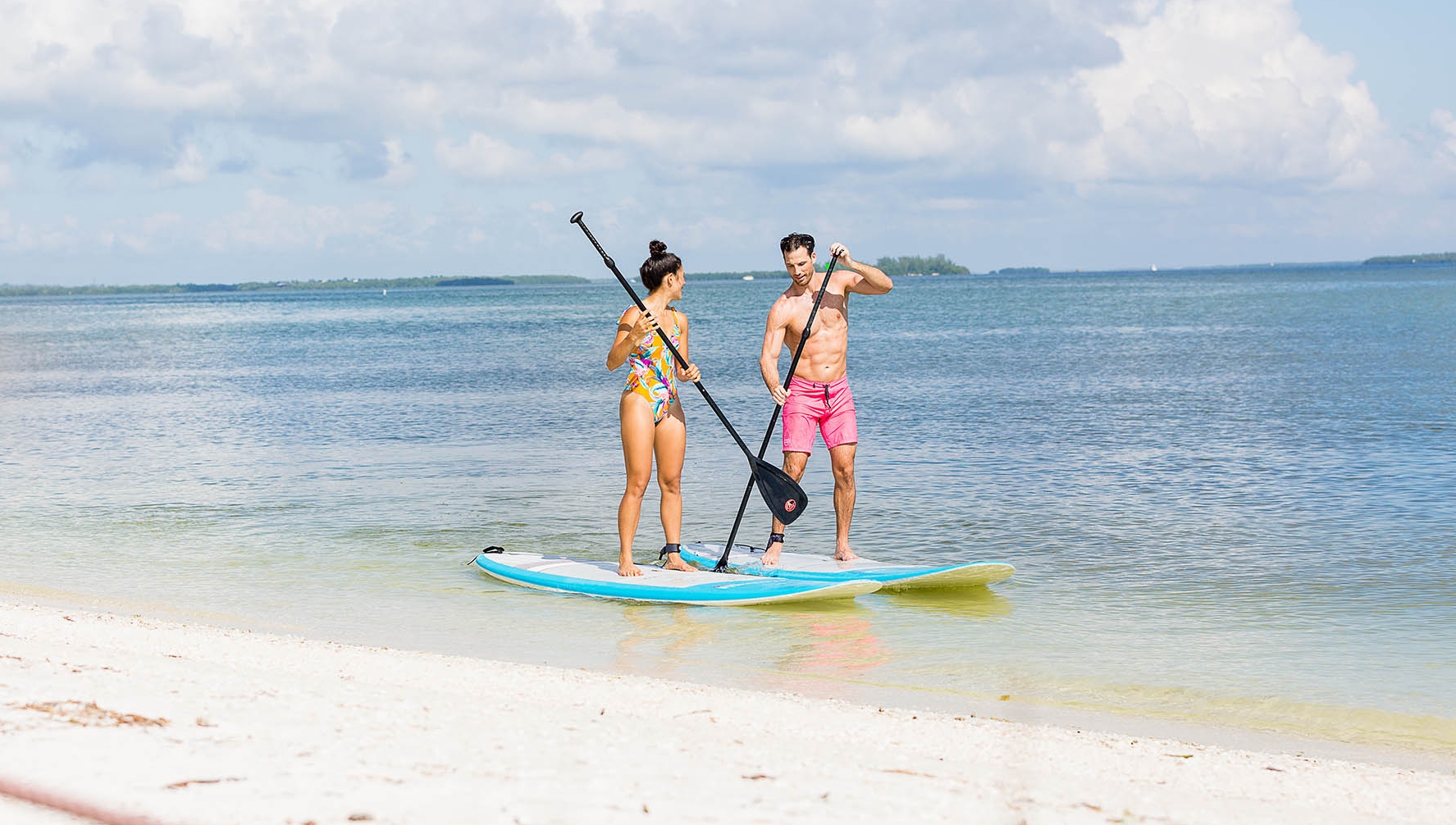 Couple on Paddle Boards on Sanibel Island