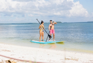 Couple on Paddle Boards on Sanibel Island