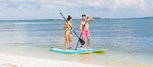 Couple on Paddle Boards on Sanibel Island