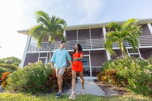 A couple walk together outside the Sanibel Inn, a top rated resort
