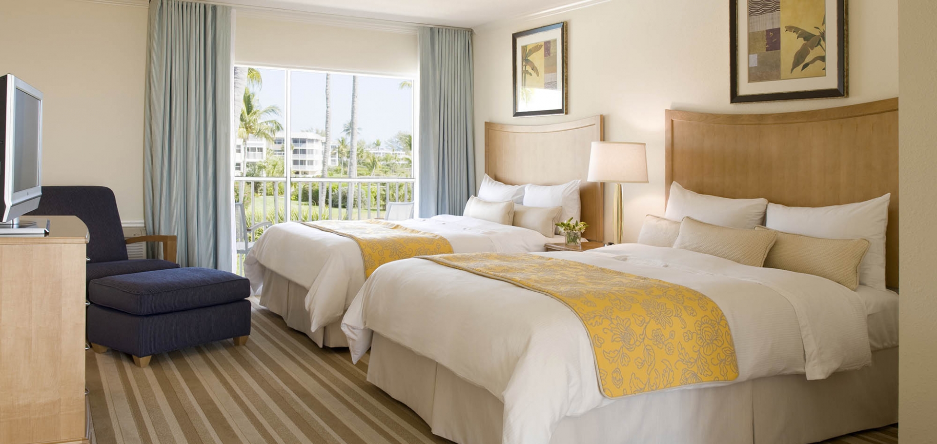 Sanibel Sunset Beach Inn guest room with two beds