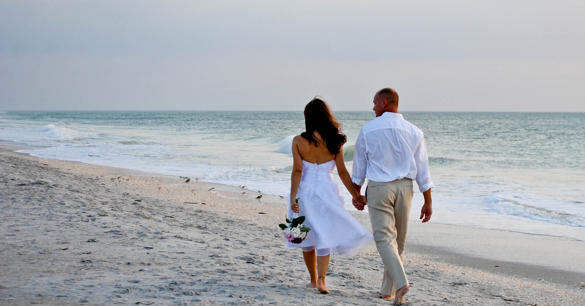 Couple walking on a Sanibel Beach