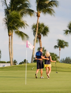 Couple walking on a golf course