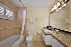 Sanibel Seaside Inn bathroom, bath, shower, and amenities