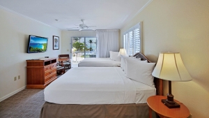Sanibel's Seaside Inn guest room with two beds and balcony view